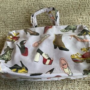 Nick and Nora Shoe Print Cosmetic bag set.